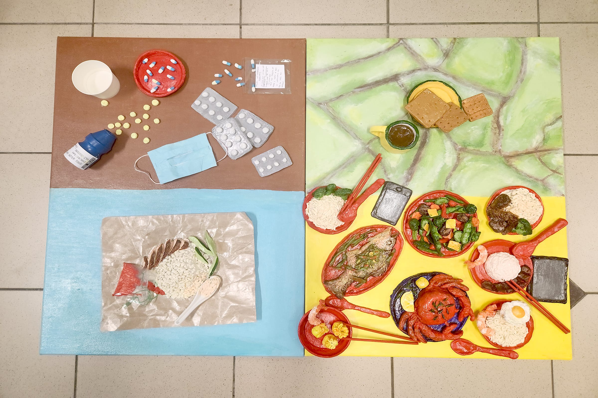 Four-panel artwork showing sculpted medicines and a mask on brown, rice on blue, food on yellow, and snacks on green.